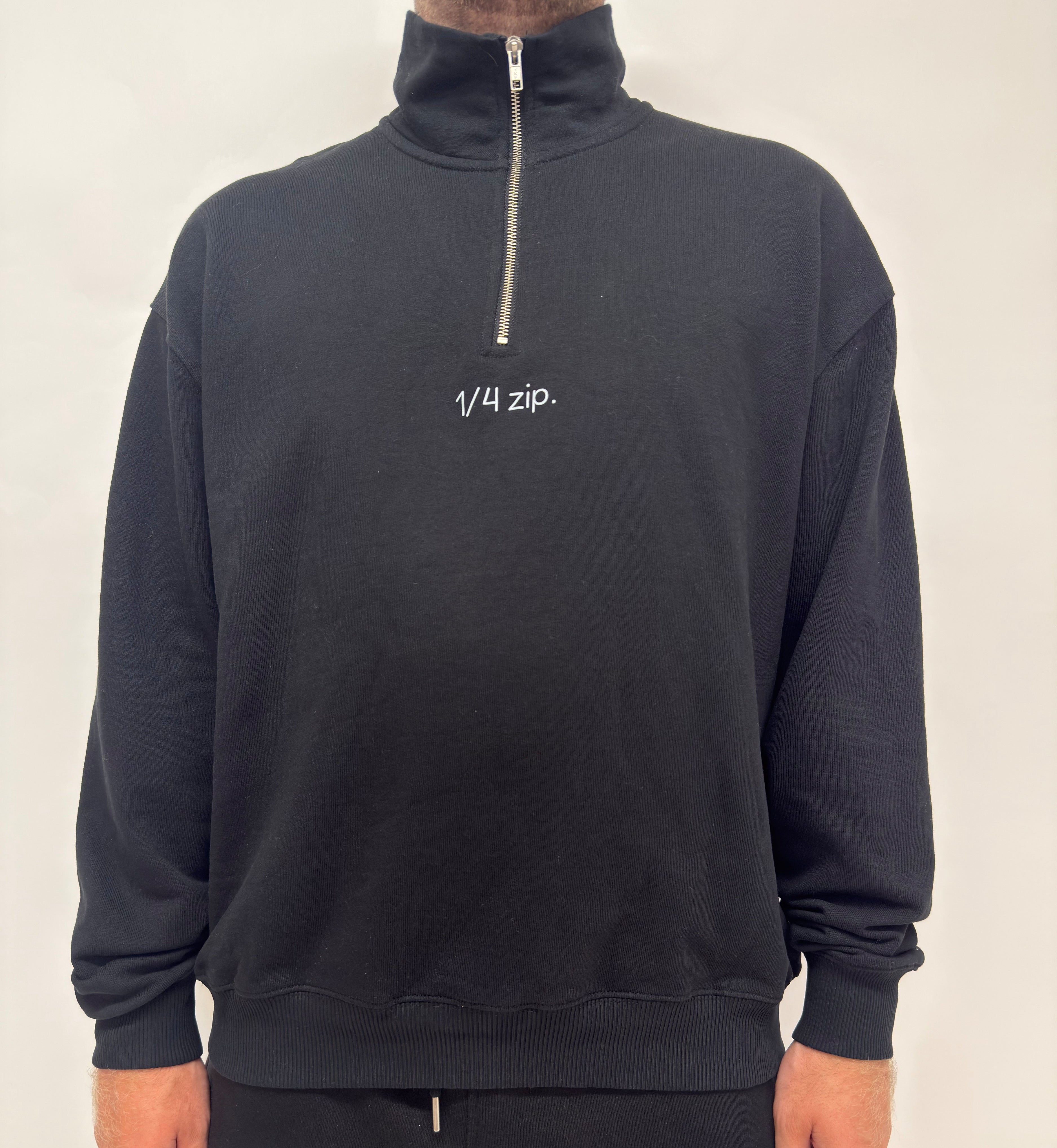 simple. heavy 1/4 zip. black.