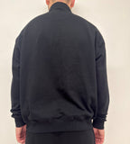 simple. heavy 1/4 zip. black.