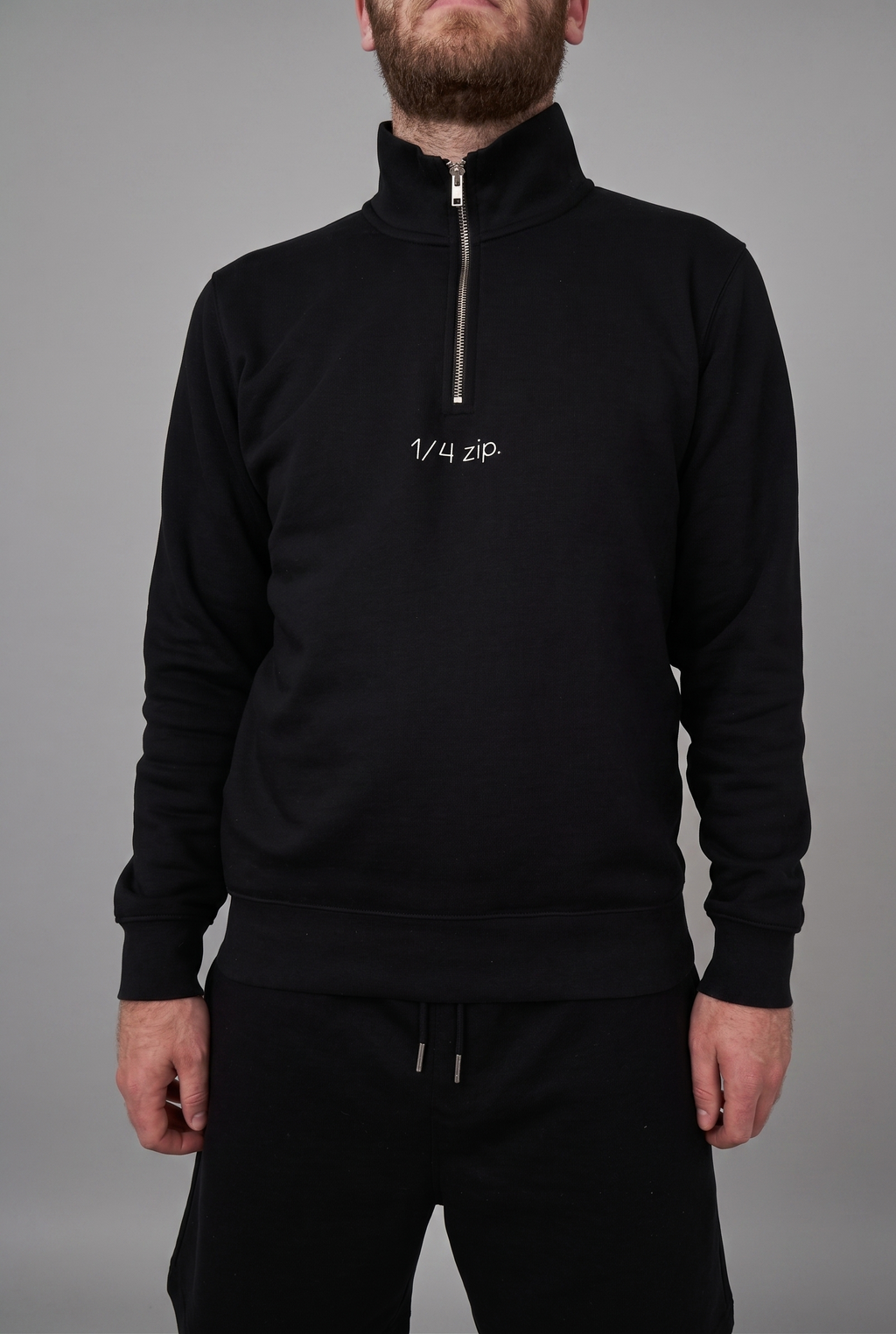 simple. light 1/4 zip. black.