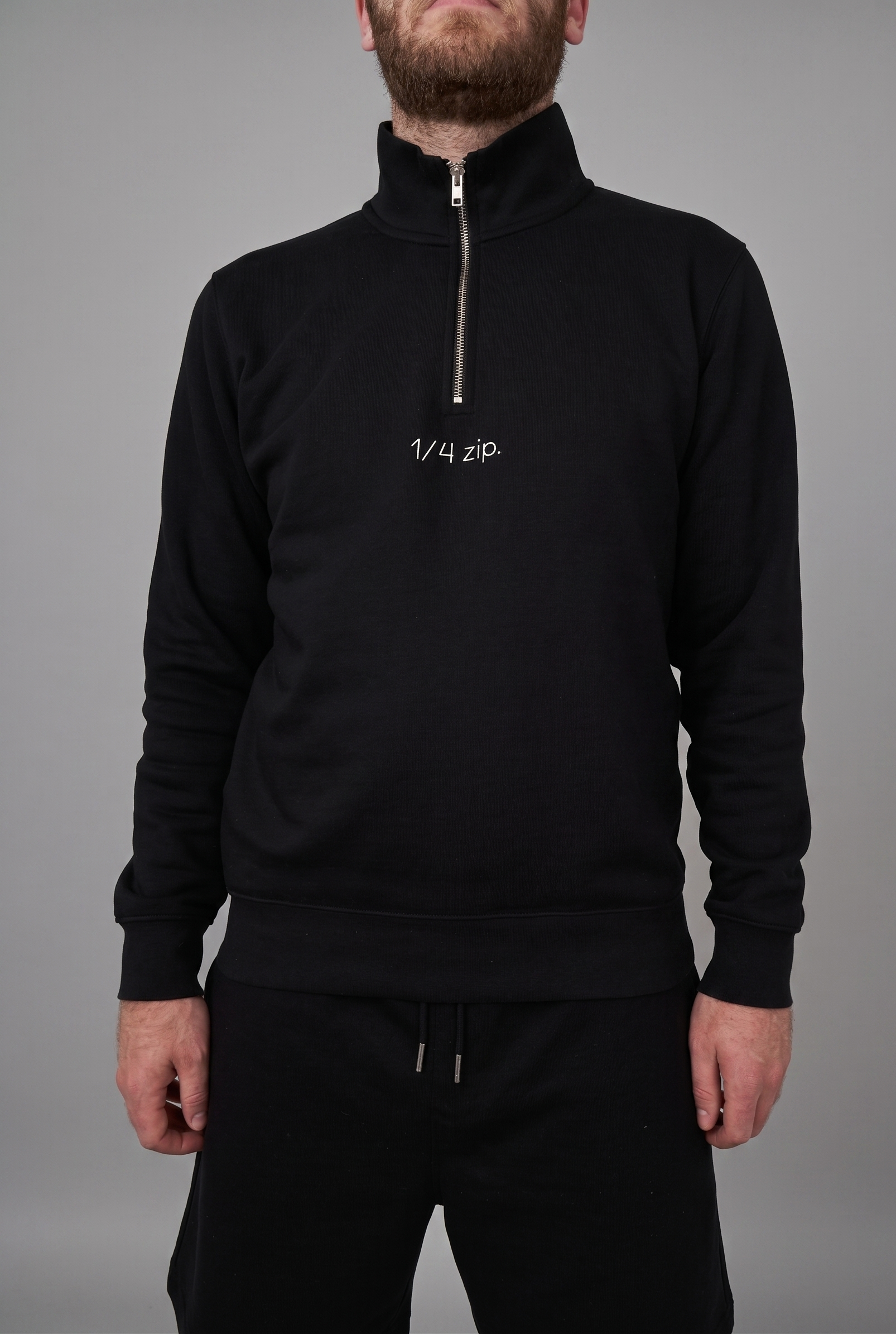 simple. light 1/4 zip. black.